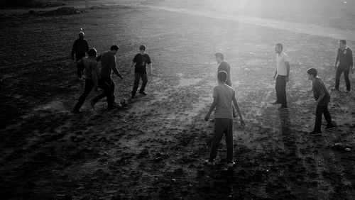 High angle view of people playing football on field