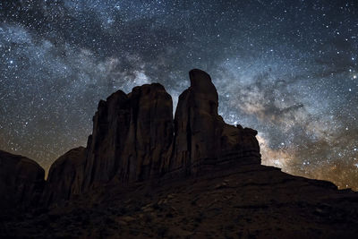 Low angle view of rock formation against sky