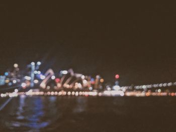 View of illuminated city buildings at night