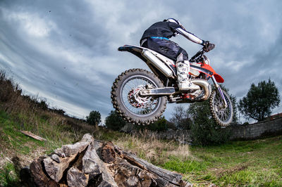 Man riding motorcycle on field