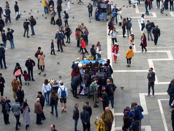 High angle view of people walking on road