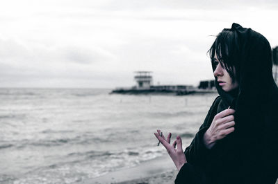 Woman standing at beach