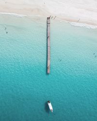 Pier and speedboat in sea