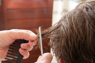 Cropped image of woman holding hair