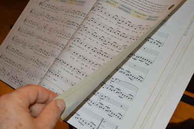 Close-up of hand holding book