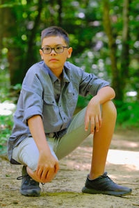 Portrait of young man sitting outdoors