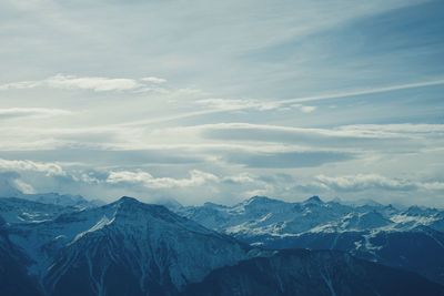 Scenic view of snowcapped mountains against sky