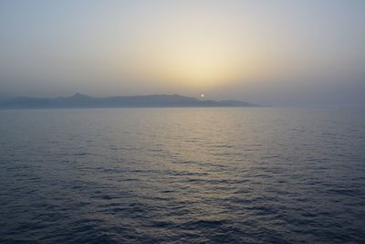 Scenic view of sea against clear sky during sunset