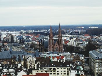 High angle view of buildings in city against sky