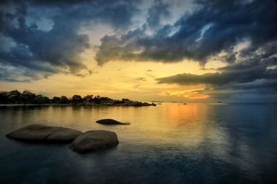 Scenic view of lake against sky during sunset