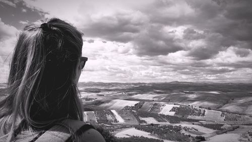 Rear view of woman against sky