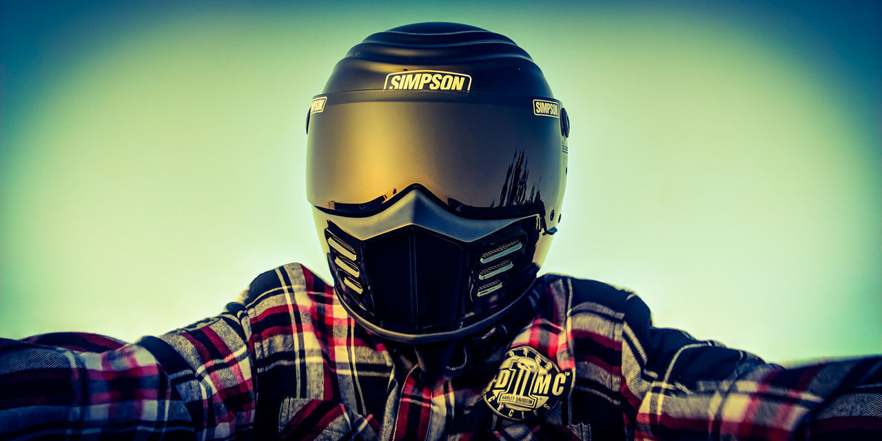 helmet, one person, headshot, portrait, headwear, front view, real people, text, men, lifestyles, sports helmet, clothing, sports equipment, young men, sport, sky, security, leisure activity, western script, crash helmet, obscured face
