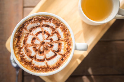 High angle view of cappuccino on table