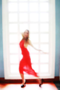 Full length of woman standing by railing