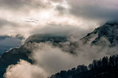 Low angle view of majestic mountains against sky