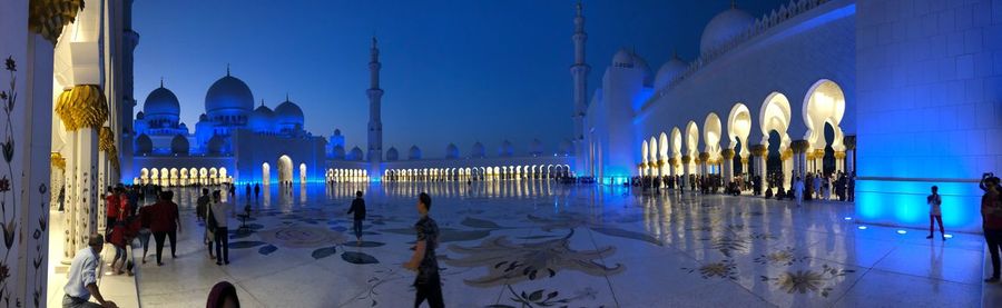 Panoramic view of city buildings at night