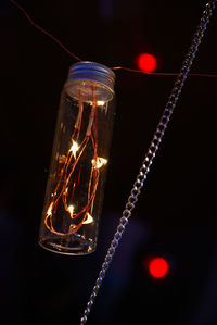Low angle view of illuminated light bulb