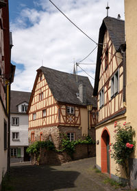 Buildings in town against sky