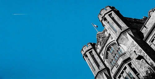 Low angle view of statue against blue sky