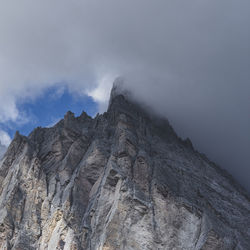 Low angle view of rock formation against sky