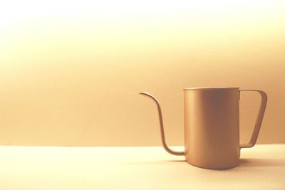 Close-up of coffee cup on table