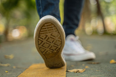 Low section of person standing outdoors