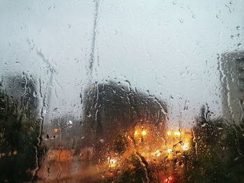 Raindrops on glass window during rainy season