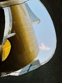 Low angle view of yellow building against sky