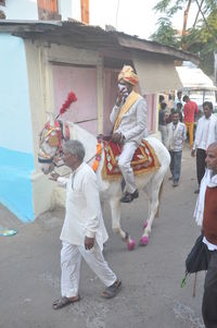 Full length of people on street in city