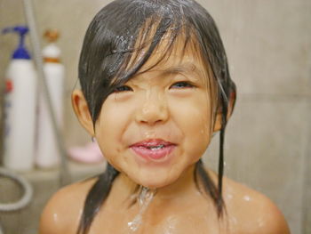 Portrait of cute boy in bathroom