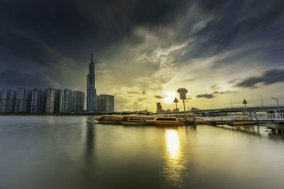 View of bridge over river against buildings