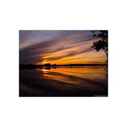 Digital composite image of sea against sky during sunset