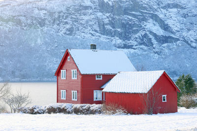 House on snow covered landscape