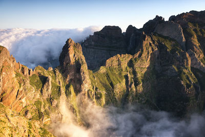 Panoramic view of rocky mountains against sky