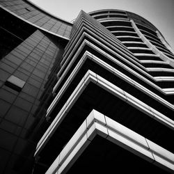 Low angle view of office building against sky