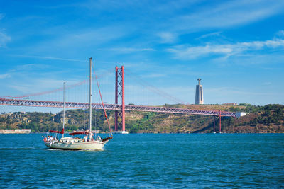 Boats in sea against sky