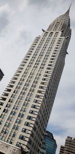 Low angle view of modern buildings against sky