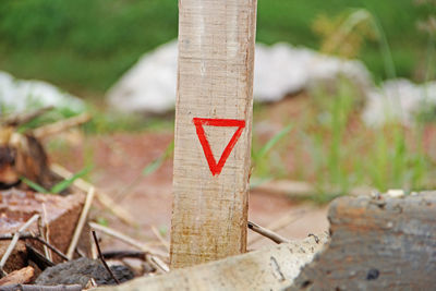 Close-up of warning sign on field