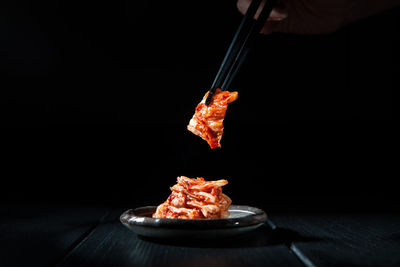 Close-up of food on table against black background