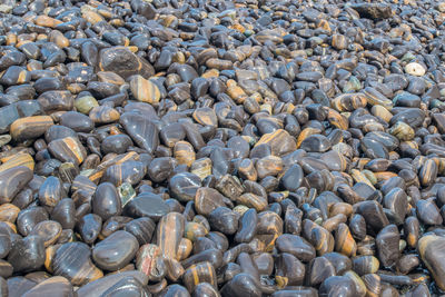 Full frame shot of pebbles at beach