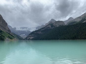 Scenic view of lake and mountains against sky