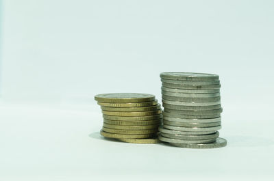Close-up of old stack against white background