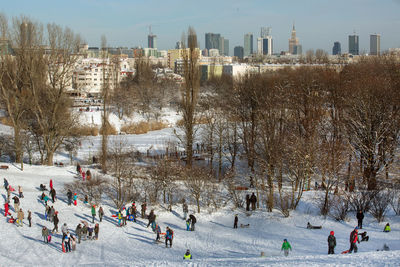Panoramic view of people in city during winter