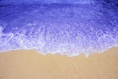 High angle view of surf on beach