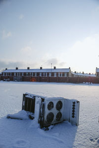 Built structure in winter against sky