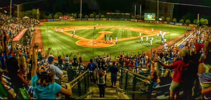 large group of people, men, leisure activity, lifestyles, illuminated, person, crowd, arts culture and entertainment, night, enjoyment, amusement park, fun, spectator, sport, mixed age range, event, city life, city, high angle view