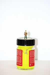 Close-up of toys on table against white background