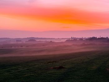Scenic view of landscape against sky during sunset