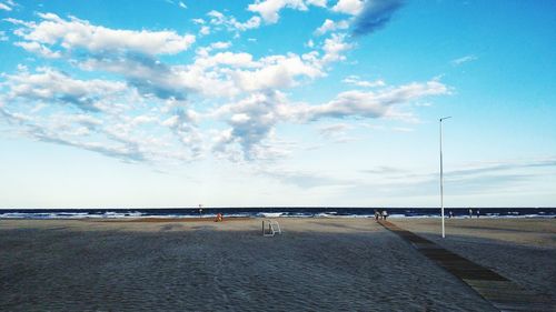 Road by sea against sky