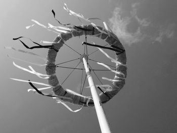 Low angle view of traditional object against sky